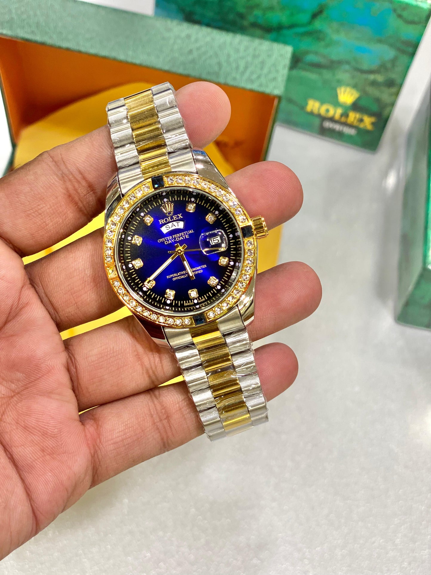 Luxury-Inspired Gold Watch with Blue Dial – Diamond & Emerald Accent Bezel